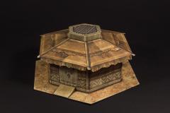 Ochre build with roof beams and raised roof top